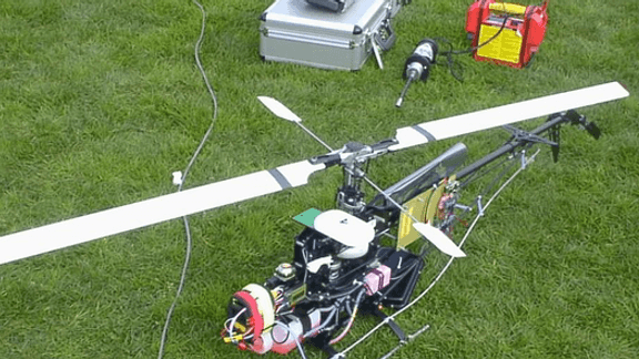 Autonomous Helicopter Tracking and Localization Using a Self-Calibrating Camera Array
